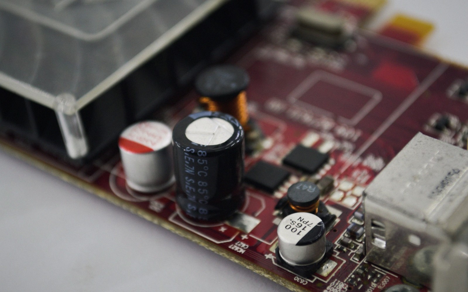 Macro view of a bare motherboard lit at a raking angle